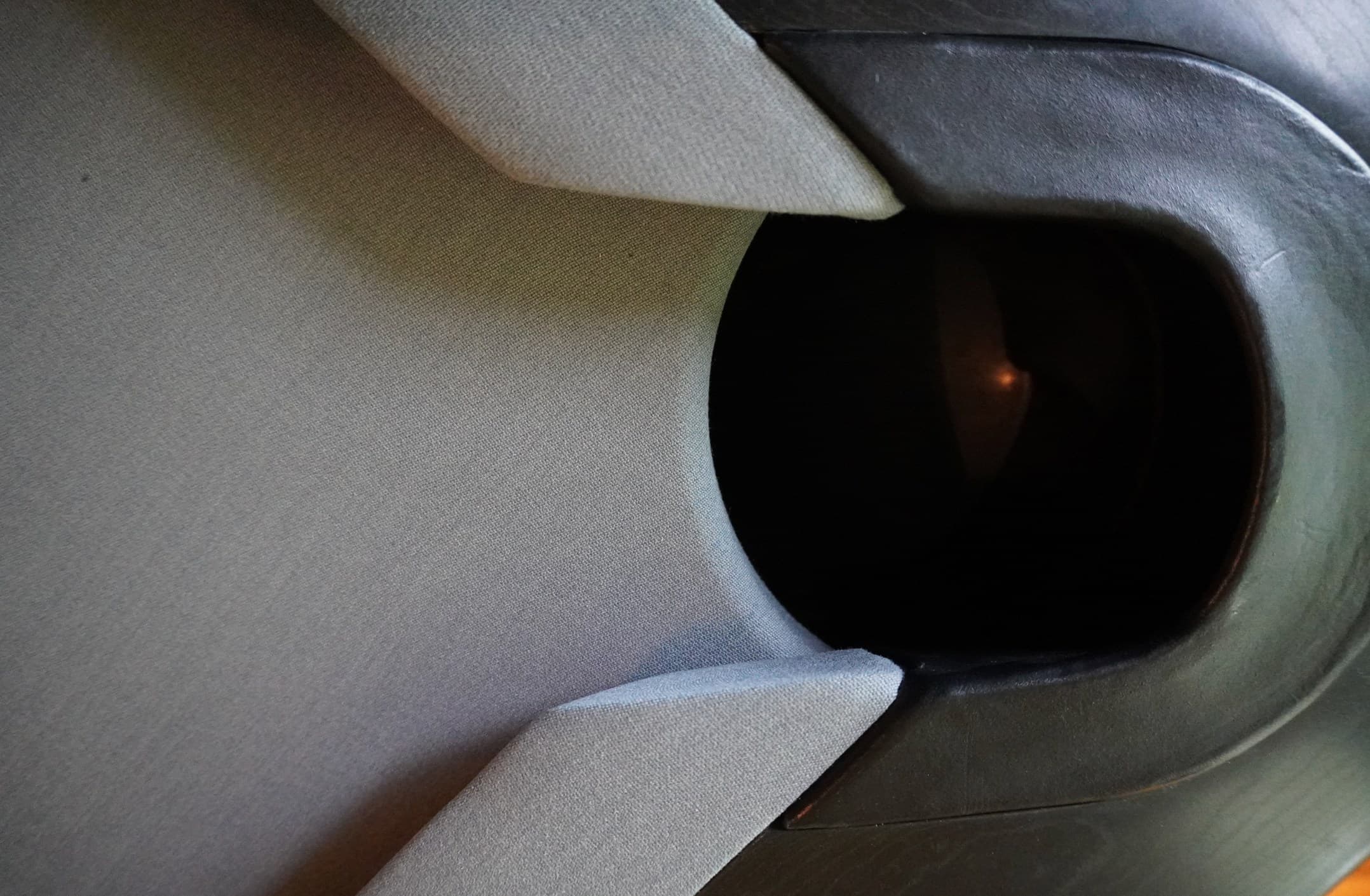 Close-up of a corner pocket with freshly installed gray cloth