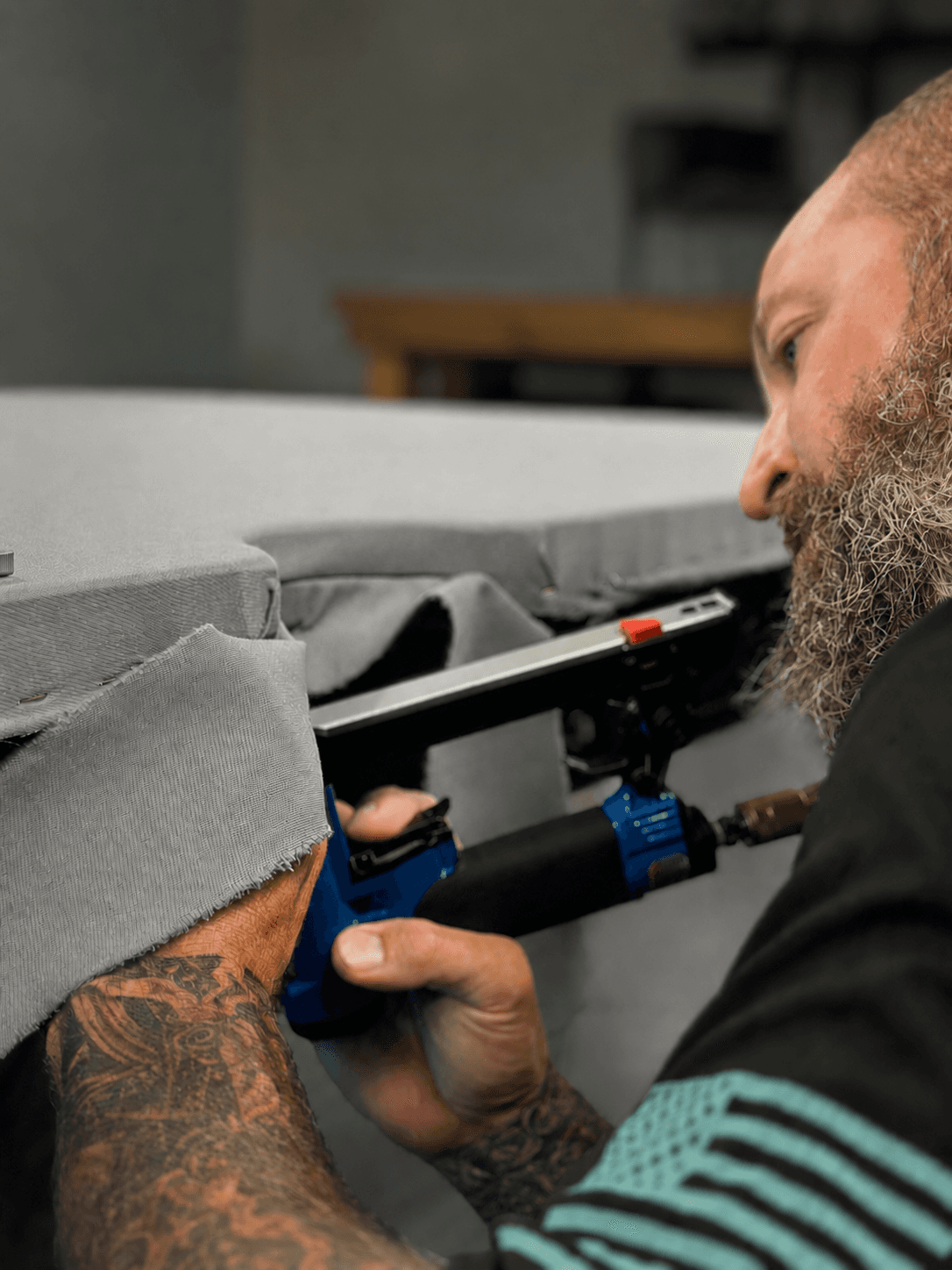 Craftsman upholstering furniture