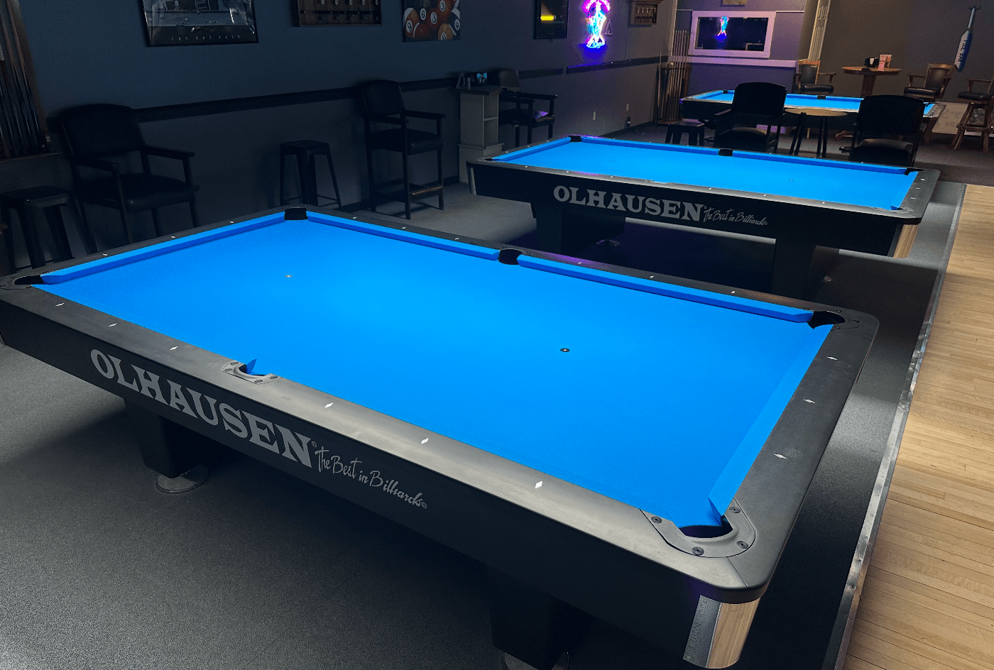 Two new Olhausen tables with blue cloth at Sharky's Billiards