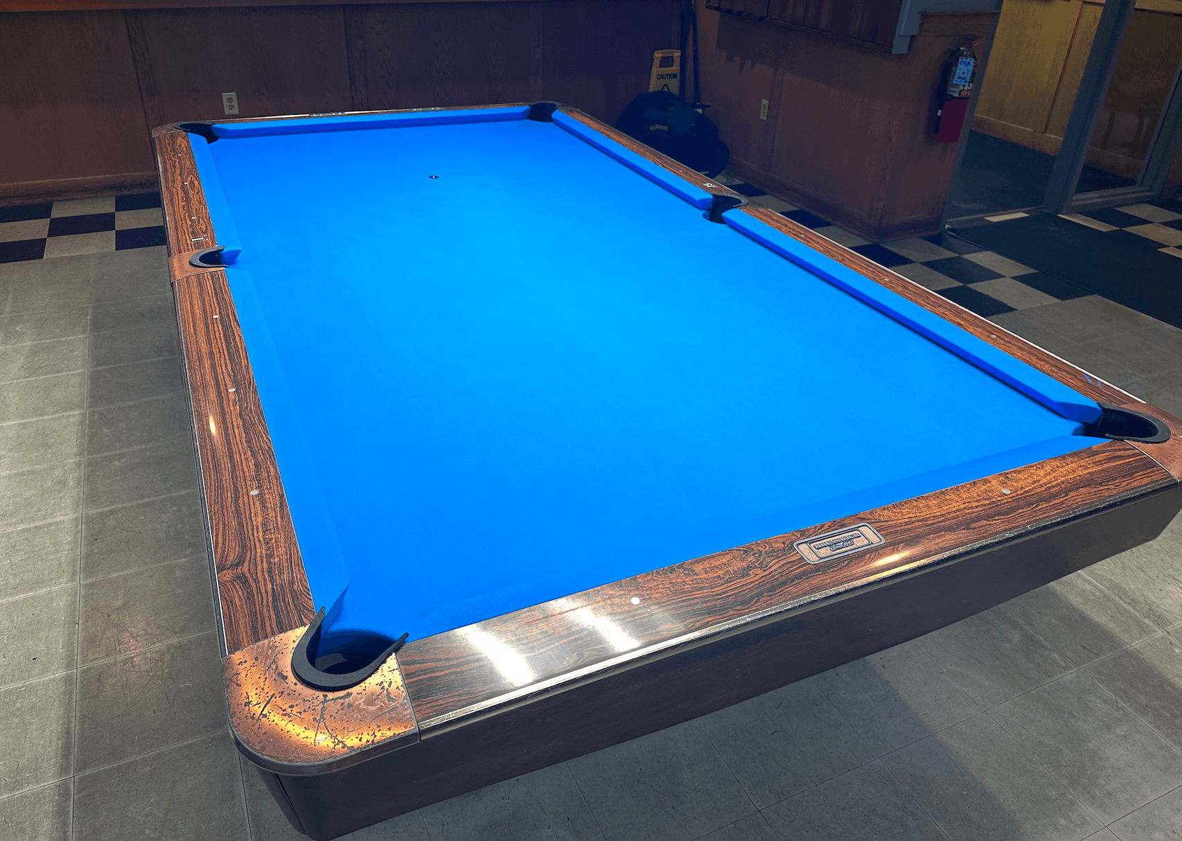 Recovered table with blue cloth on a checkered floor