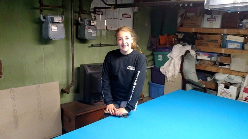 Kendra Morasse at age 12, learning the trade in the family shop
