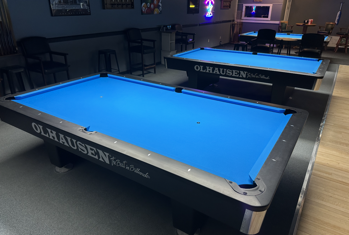 Two new Olhausen tables with blue cloth at Sharky's Billiards