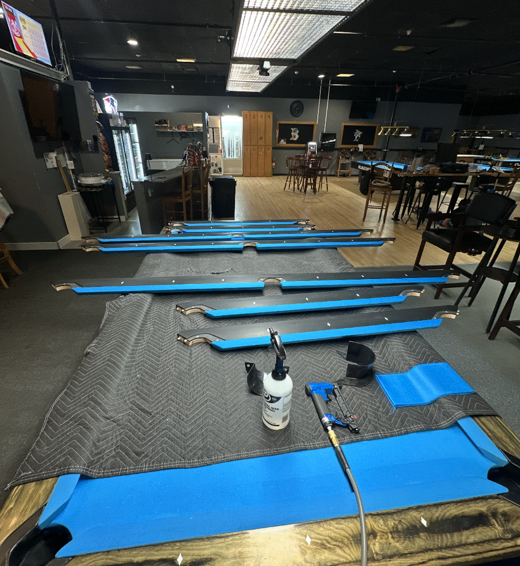 Olhausen rails being installed during the table setup at Sharky's Billiards