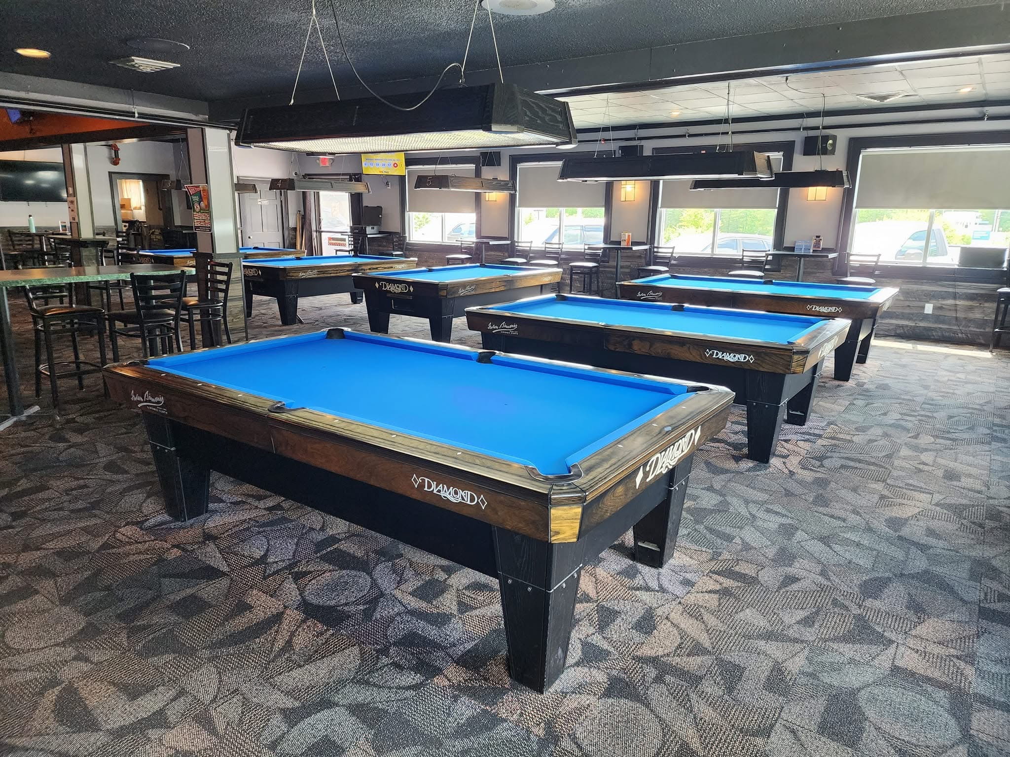 Rows of Diamond tables with blue Simonis cloth at The Nest